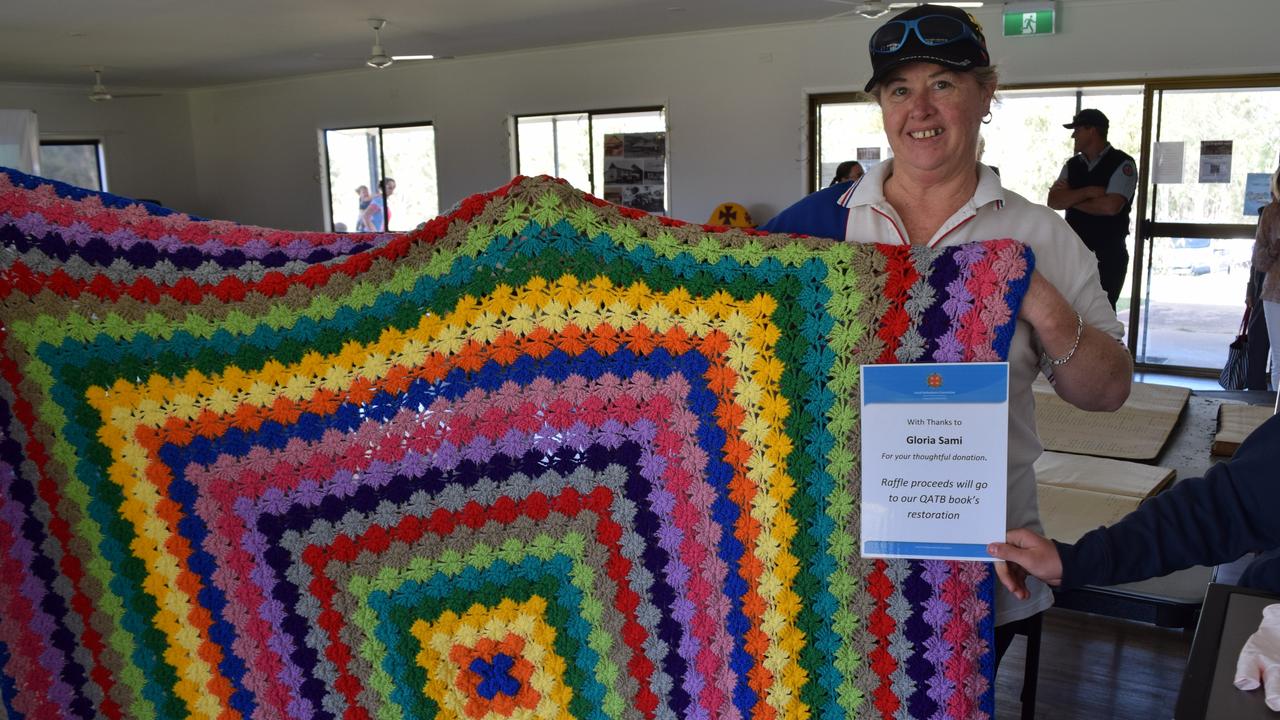 Tracey Warner with a donated crochet blanked by Gloria Sami.