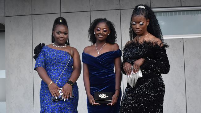 Caline Kanyamuneza, Riziki Nundu, and Kashindi Ivunda at the 2021 Bundamba State Secondary College year 12 formal, Ipswich Turf Club 17th of November 2021. Picture: Jessica Baker