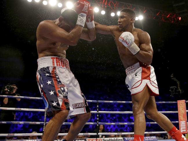 British boxer Anthony Joshua, right, fights U.S. boxer Dominic Breazeale during their IBF heavyweight title bout at the O2 Arena in London, Saturday, June 25, 2016. (AP Photo/Matt Dunham)