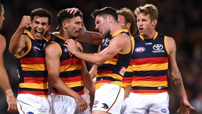 Jones celebrates with teammates Josh Rachele and Izak Rankine in the Showdown. Picture: Mark Brake/Getty Images