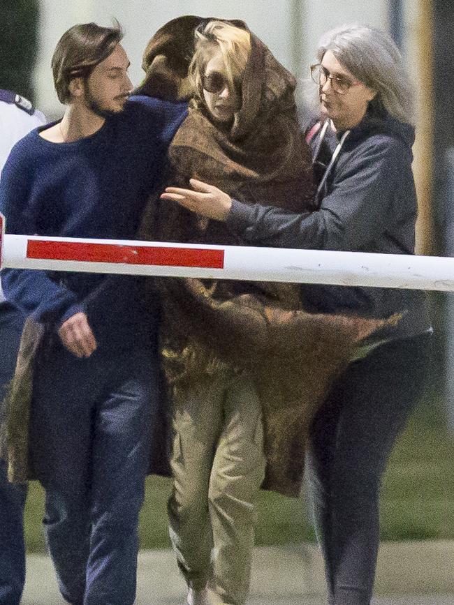 Hannah Quinn wrapped in a blanket as she leaves Silverwater Jail with her family after being granted bail in August. Picture: Damian Shaw