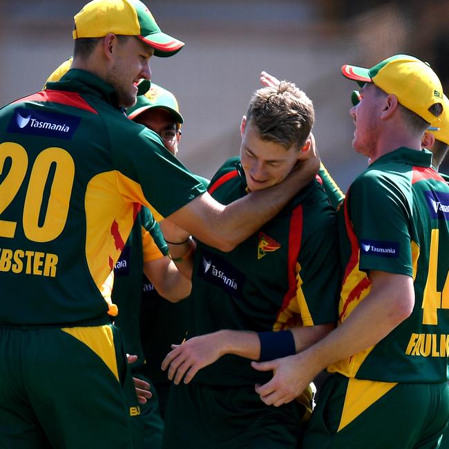 Riley Meredith of the Tigers (centre) celebrates with teammates after taking the wicket of Steve Smith during the Marsh One Day Cup. Picture: AAP/DAN HIMBRECHTS