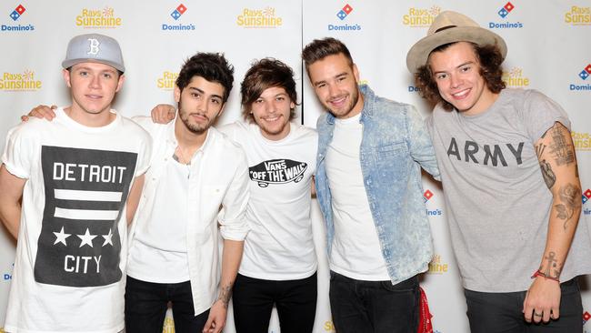 Tomlinson with former and current One Direction bandmates (from left) Niall Horan, Zayn Malik, Liam Payne and Harry Styles. (Picture: Stuart C. Wilson/Getty Images)