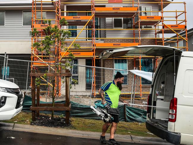 LAKE MACQUARIE, AUSTRALIA - MAY 06: A wardrobe installer prepares to work at a construction site at Cameron Park on May 06, 2024 in Lake Macquarie, New South Wales, Australia. Australia's Labor government is grappling with a slowing economy, weaker commodity prices, soaring housing costs and a softening labor market as it prepares to unveil its federal budget on May 14. To counter these headwinds, the budget is expected to feature smaller revenue upgrades compared to recent years, while outlining the government's interventionist policies aimed at boosting domestic manufacturing and the transition to green energy. Critics warn that such industrial policies risk fueling inflation and diverting resources from more productive sectors of the economy. (Photo by Roni Bintang/Getty Images)