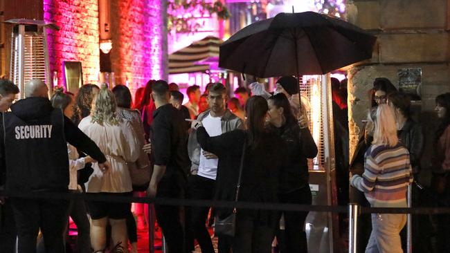 A large crowd of people queue up outside the Argyle in the Rocks on Saturday. Picture: Damian Shaw