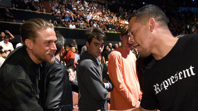 Nate Diaz (right) shakes hands with actor Charlie Hunnam at UFC 199.