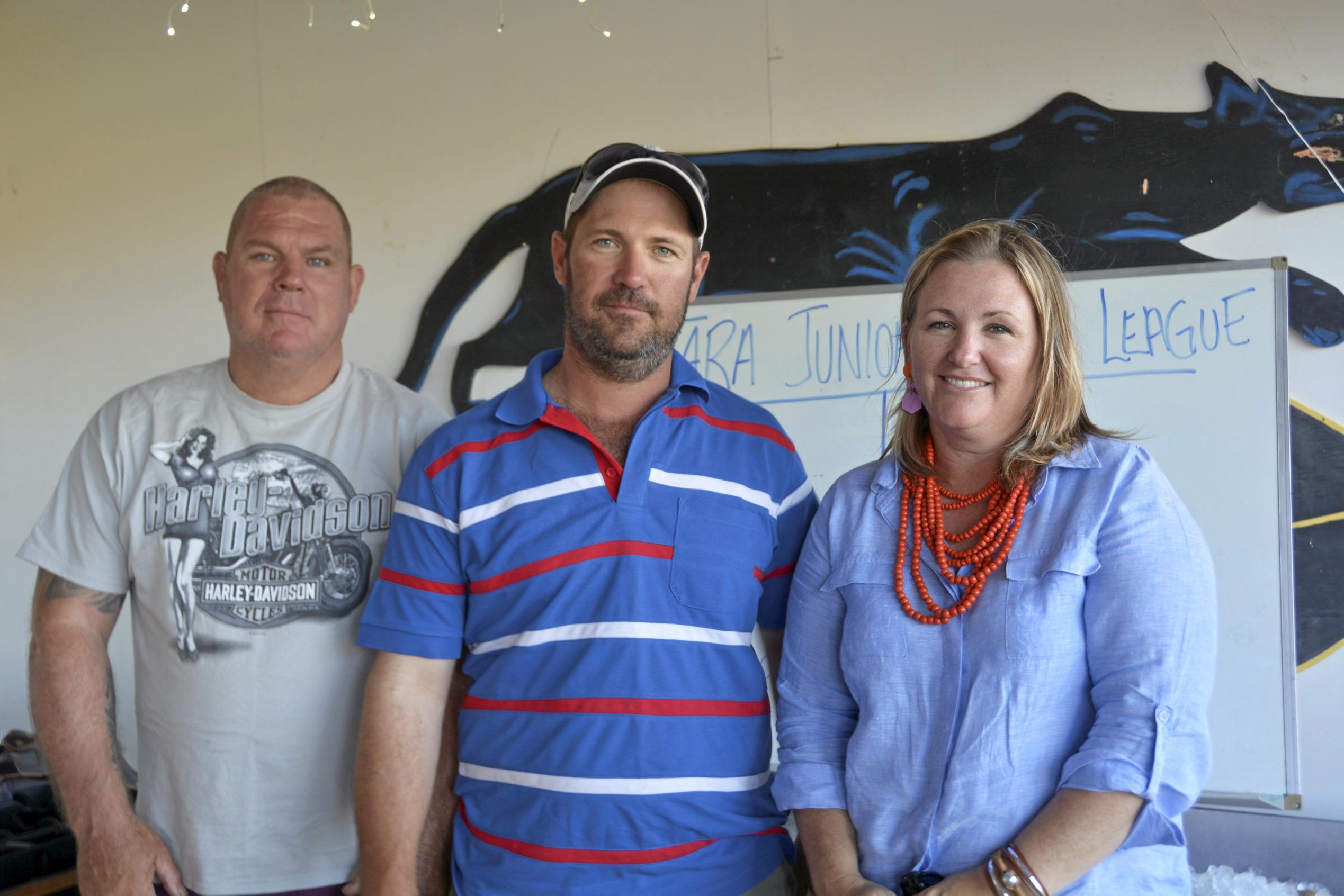 Kev Ash with Cameron and Carissa Hallinan serve the drinks the Tara Christmas Carnival 081218. Picture: Eloise Quinlivan