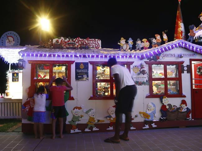 Visitors look into Santa's workshop at the Overton’s home. Picture: John Appleyard