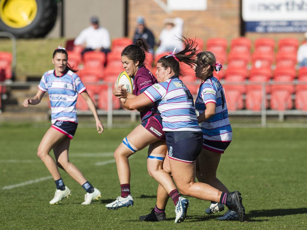 Lily Black of Toowoomba Bears Womens 7s is tackled by Roma Echnidas Womens 7s player Renee Donpon. Picture: Kevin Farmer