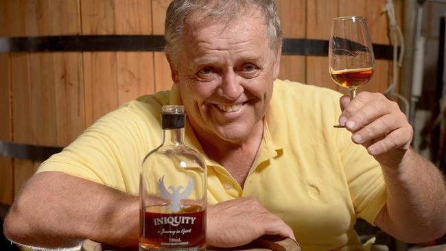 22/1/16. The Tin Shed distilling Company just sold its latest two Iniquity releases within hours. One listed by in Jim Murray's international Whisky Bible as liquid gold. They have a new still arriving to enable them to triple production and owners think SA could rival international whisky countries in a few years. Ian Schmidt with a glass of his liquid gold and bottle of Iniquity at the distillery. Pic: Keryn Stevens