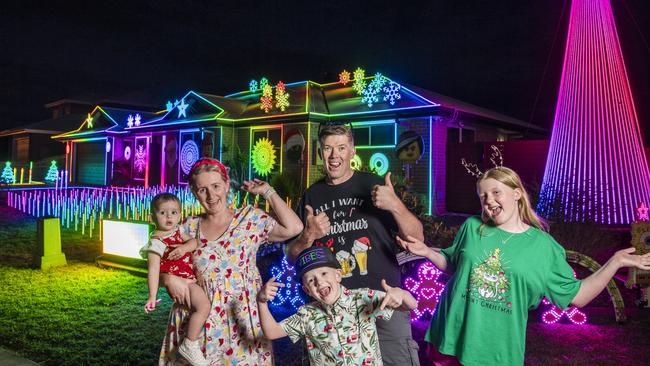 The Kearneys Spring Christmas lights display of the Scarborough family (from left) Nicole Scarborough holding Lily Maskill, Archie Scarborough, John Scarborough (back) and Kaitlyn Scarborough. Picture: Kevin Farmer