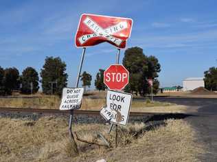 Damaged signs by the railway crossing on Dawson's Gate Rd, Chinchilla near the Warrego Highway. Picture: Madison Watt