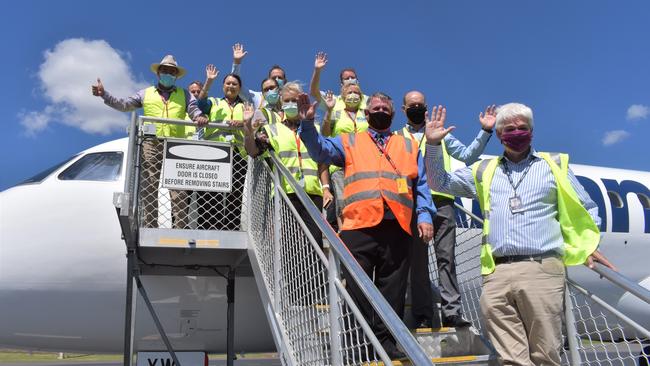 Councillors and politicians pictured with the new Alliance Embraer E190 parked at Rockhampton Airport.