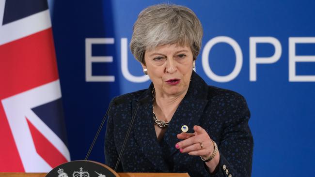 Theresa May takes questions from the media in Brussels after meeting European Union officials about Britain’s exit from the organisation  