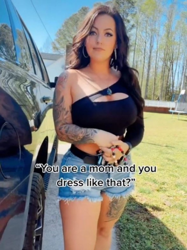 She says she won't stop wearing crop tops and tiny shorts that show off her curves. Picture: TikTok/ beautywithaj