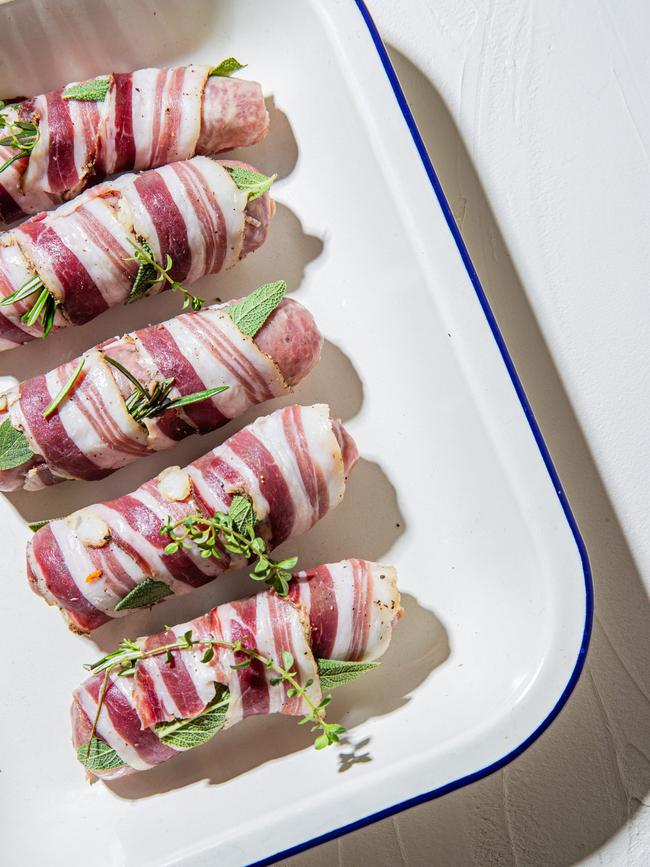 Wrapped with pancetta and herbs, these snags are a cut above. Photos: Nikki To / TWAM