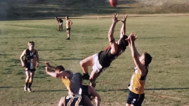 Dan Roberts takes a spectacular mark for the North Shore Bombers.