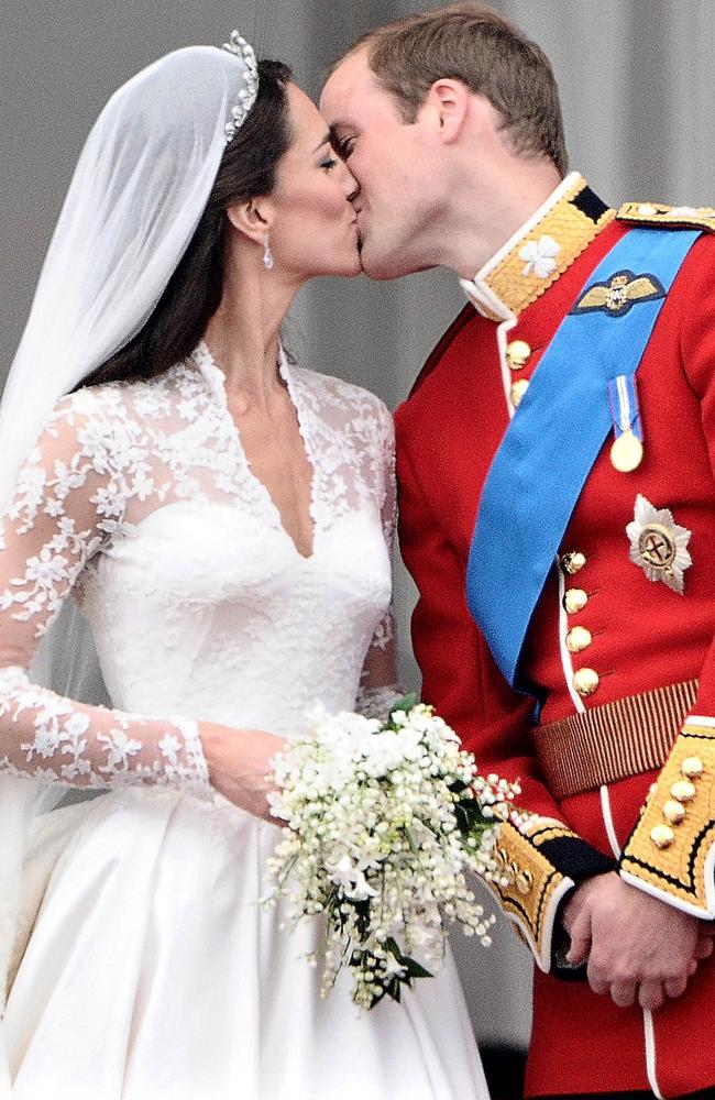 The famous kiss between Kate Middleton and Prince William on the balcony of Buckingham Palace after they were wed. Picture: AFP