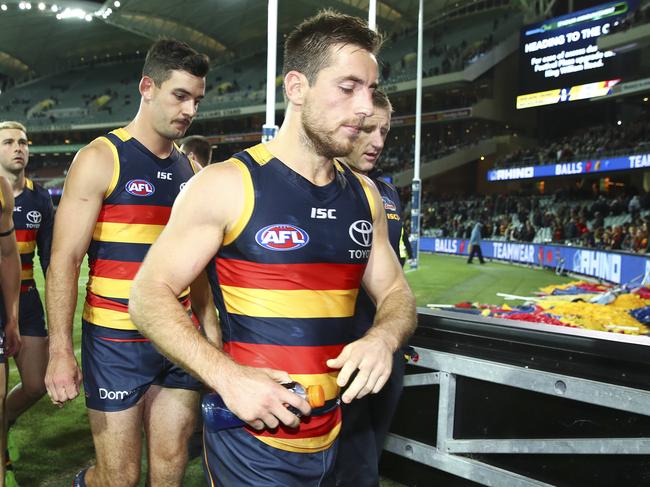 AFL - Adelaide Crows v Melbourne Demons - Round 8 at Adelaide Oval. Crows players including Richard Douglas and Taylor Walker walk off the oval after the loss. Picture Sarah Reed