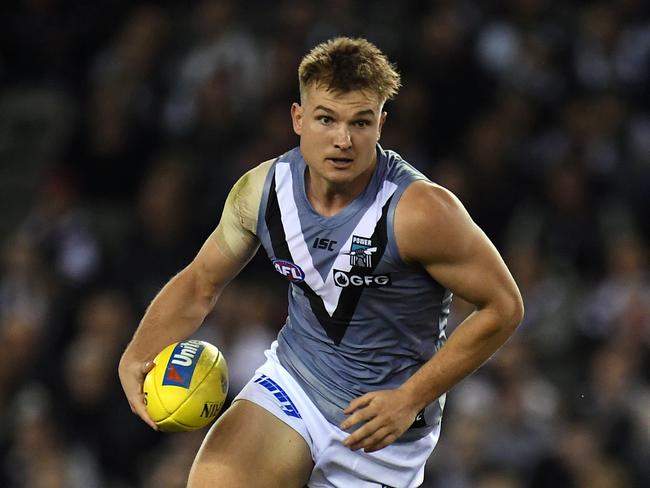 Ollie Wines of the Power is seen in action during the Round 7 AFL match between the Collingwood Magpies and the Port Adelaide Power at Marvel Stadium in Melbourne. AAP Image/Julian Smith