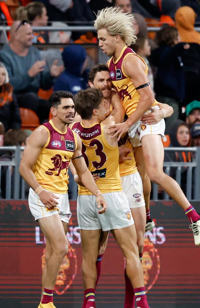 Joe Daniher is mobbed after his last-quarter heroics. Picture: Dylan Burns/AFL Photos via Getty Images