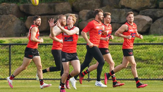 Conor McKenna trains with teammates including Michael Hurley and Cale Hooker last week.