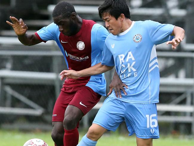 Coomera’s Ferdinand Annor battles Palm Beach’s Shota Iunima in this season’s Gold Coast Premier League. Picture: Richard Gosling