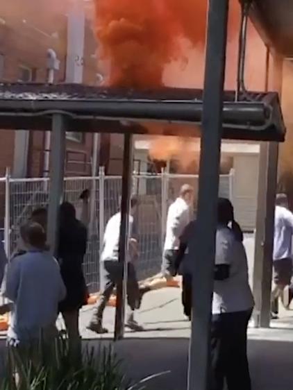 Orange plumes of smoke in the schoolyard. Picture: Supplied