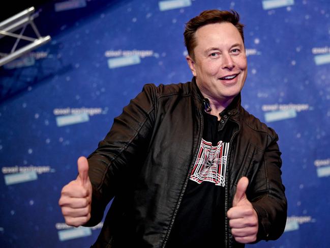 (FILES) In this file photo taken on December 1, 2020 SpaceX owner and Tesla CEO Elon Musk poses as he arrives on the red carpet for the Axel Springer Awards ceremony, in Berlin. - The fortunes of the world's ten richest men have doubled since the start of the pandemic while the incomes of 99% of humanity have shrunk, according to an Oxfam report on Monday, January 17. (Photo by Britta Pedersen / POOL / AFP)