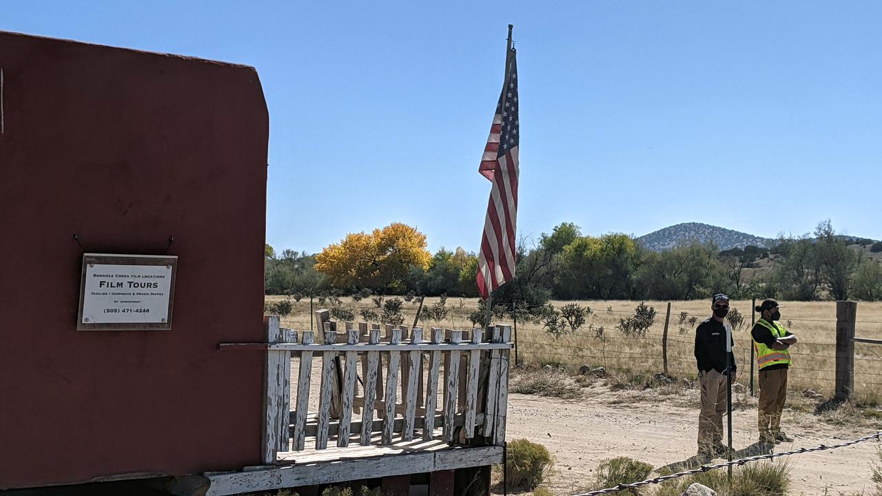 Security guards stand at the entrance of Bonanza Creek Ranch in Santa Fe, New Mexico. Picture: AFP