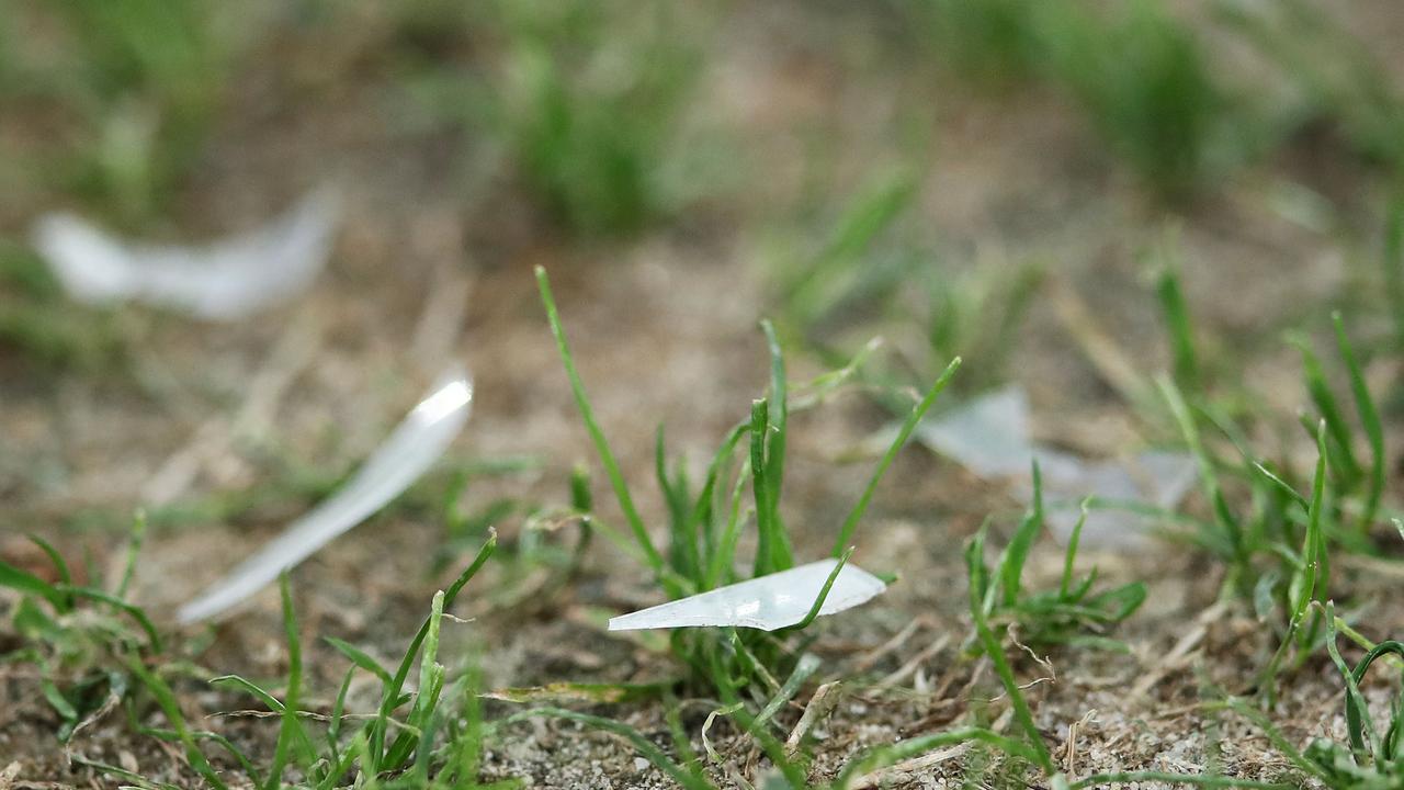 Shards of hard plastic are seen on the pitch