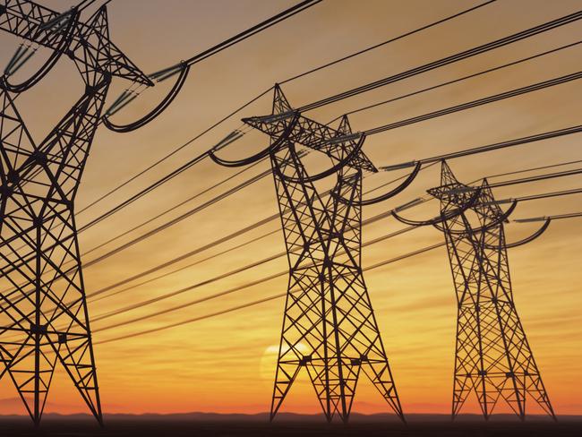 The silhouette of the high voltage power lines during sunset.