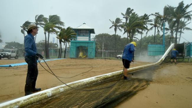 Heavy rain lashes Townsville causing flash flooding. The stringer net is removed from the Stand Park beach. Picture: Evan Morgan