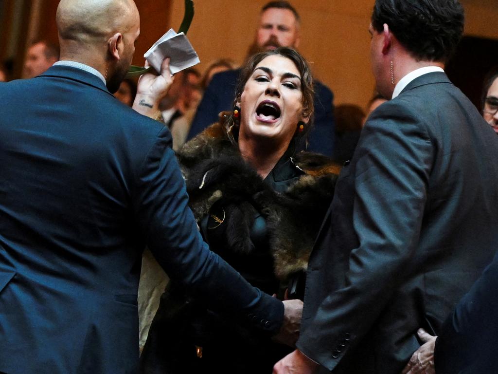 Australian Senator Lidia Thorpe stages a protest as Britain's King Charles and Queen Camilla attend a Parliamentary reception in Canberra, Australia - 21 Oct 2024. Victoria Jones/Pool via REUTERS TPX IMAGES OF THE DAY