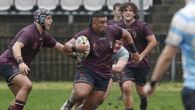 Queensland's PJ Poutasi with the ball.