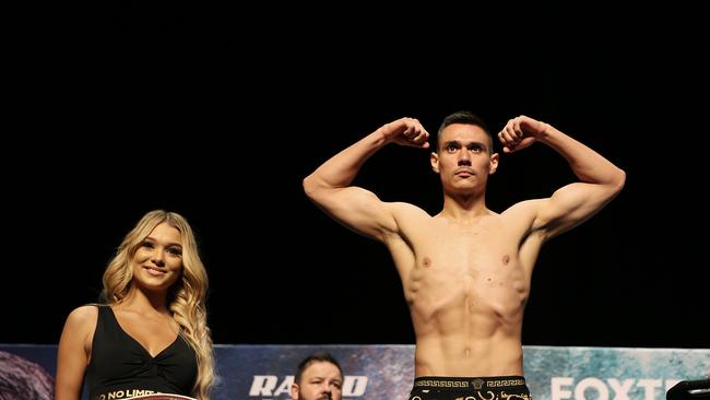 NEWCASTLE, AUSTRALIA – NewsWire Photos – March 30, 2021. Tim Tszyu hits the scales. Tim Tszyu and Dennis Hogan face off and officially weigh in at Newcastle Civic Theatre ahead of tomorrow night's Steel City Boxing Showdown at Newcastle Entertainment Centre. Picture: NCA NewsWire / Peter Lorimer.