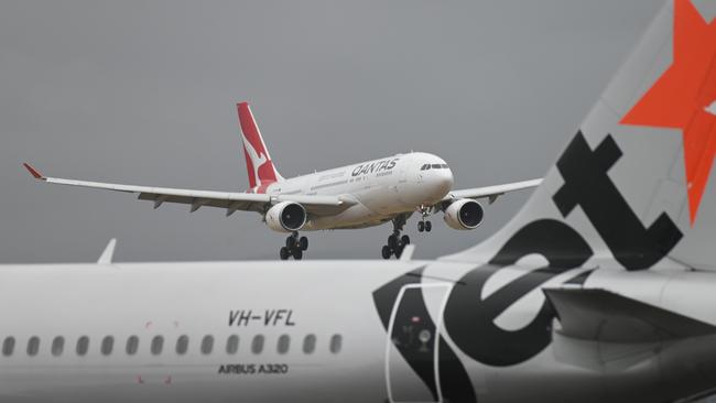 ADELAIDE, AUSTRALIA - NewsWire Photos DECEMBER 13, 2021: Players and officials from the Australian and English cricket teams arriving into Adelaide Airport on a Qantas charter flight.  Picture: NCA NewsWire / Naomi Jellicoe