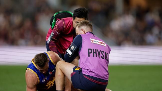 Brisbane’s medical staff tend to Jack Payne after he injured knee against Carlton. Picture: Russell Freeman/AFL Photos via Getty Images