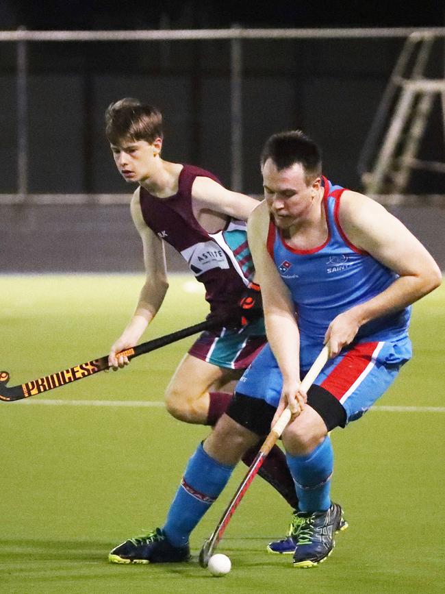 Saints' Daniel Pittendreigh pushes the ball up in the Cairns Hockey A Grade Men's match between Cairns Brothers and Cairns Saints. PICTURE: BRENDAN RADKE