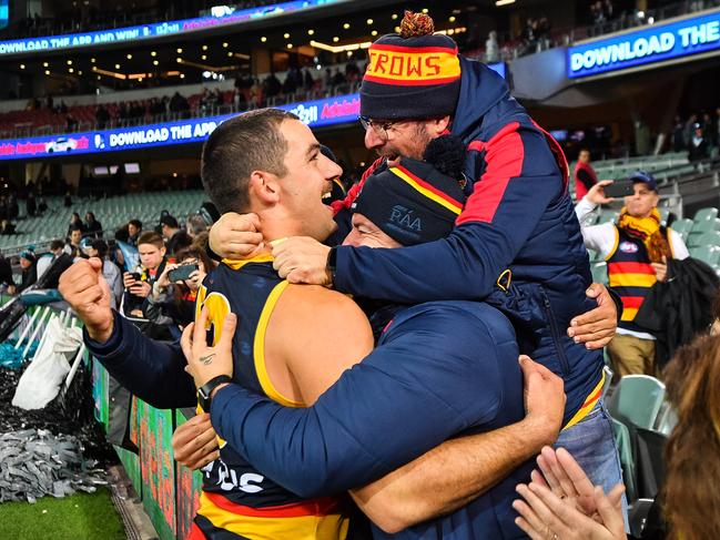 ADELAIDE, AUSTRALIA - MAY 11: Taylor Walker of the Crows celebrates with fans during the round eight AFL match between the Port Adelaide Power and the Adelaide Crows at Adelaide Oval on May 11, 2019 in Adelaide, Australia. (Photo by Daniel Kalisz/Getty Images)