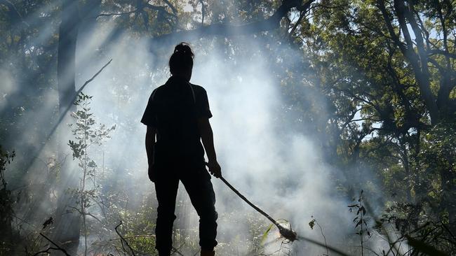 Coffs Harbour Local Aboriginal Land Council land and sea ranger Narina Ferguson at a cultural burn.