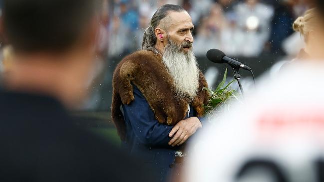 MELBOURNE, AUSTRALIA - APRIL 25: Uncle Colin Hunter delivers Welcome to Country during the 2025 AFL Round 07 match between the Collingwood Magpies and the Essendon Bombers at the Melbourne Cricket Ground on April 25, 2025 in Melbourne, Australia. (Photo by Michael Willson/AFL Photos via Getty Images)