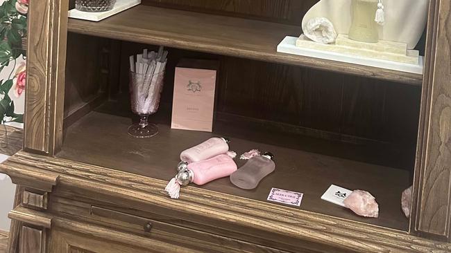 Stripped shelves at Parfumerie Enchante after a robbery that took nearly $30,000 in stock.