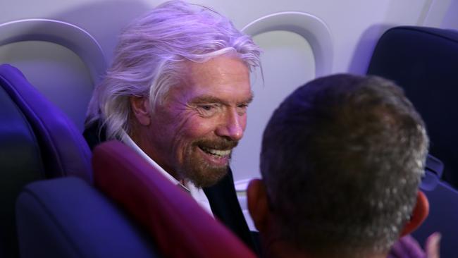 Sir Richard Branson does his best to reduce his carbon footprint ... by flying in one of his jets. Photo: Jane Dempster