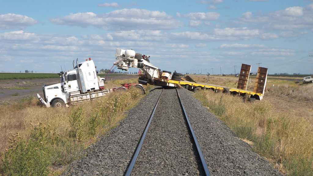 The truck stranded on railway lines after it left the Warrego Hwy. Picture: Geoff Lapthorne