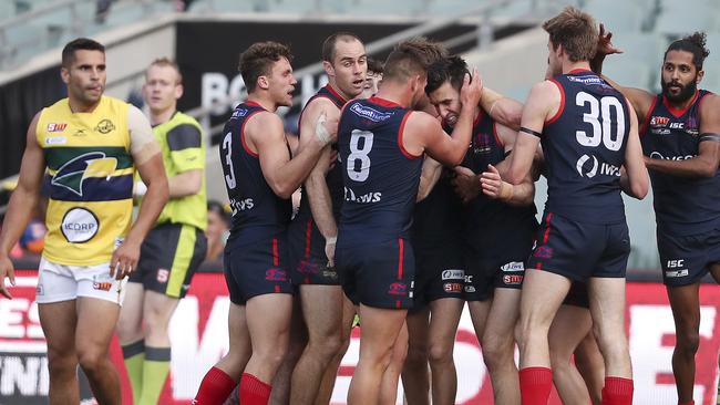 Norwood players gather around Matthew Panos after he kicked a goal on Sunday. Picture Sarah Reed