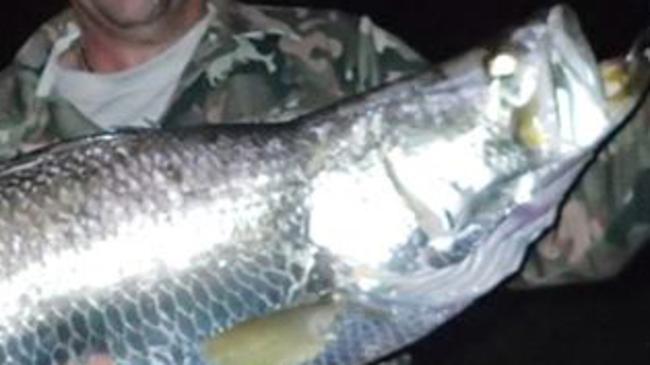 Alex Patsalides with the sixth metery barramundi he has caught while fishing from on land this year.