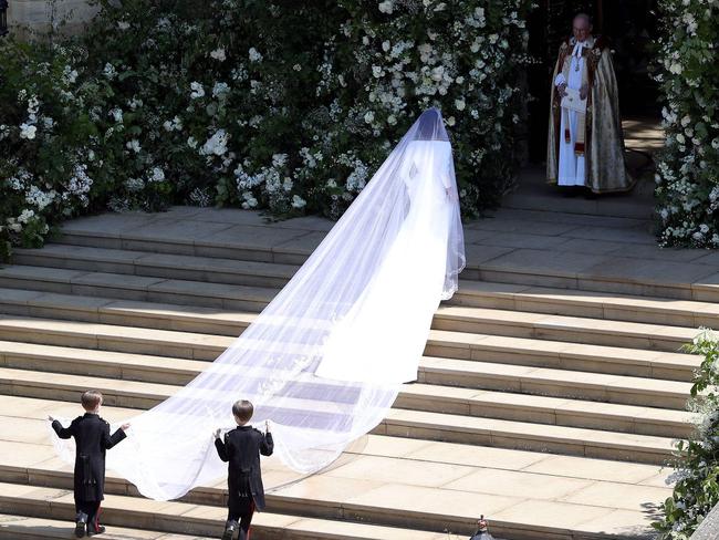 Meghan Markle is met at the door to the church. Picture: AFP PHOTO / POOL / Andrew Matthews