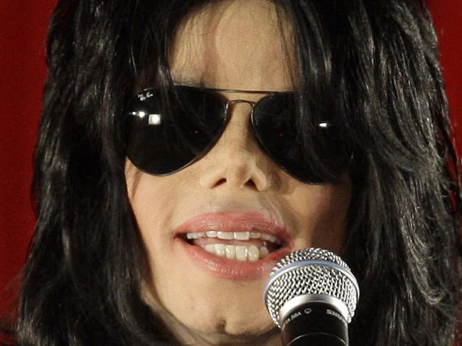 FILE - In this March 5, 2009 file photo, US singer Michael Jackson announces that he is set to play ten live concerts at the London O2 Arena in July, which he announced at a press conference at the London O2 Arena. Five years after Jackson's untimely death at age 50, the singer remains a pop culture powerhouse, proving to be just as big a moneymaker in death as in life. Jackson’s death returned him to the top of the record charts and quickly generated hundreds of millions of dollars through deals for new albums and a movie created from his final rehearsals for his planned “This Is It” comeback concerts. (AP Photo/Joel Ryan, File)