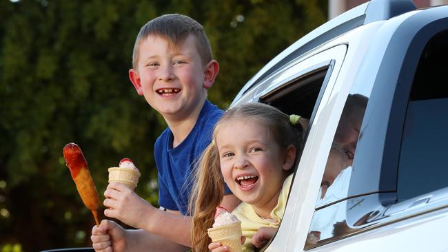 Elliot Stokes, 7, and sister Margaret, 5, in the Ekka drive-through at Bowen Hills. Photographer: Liam Kidston.